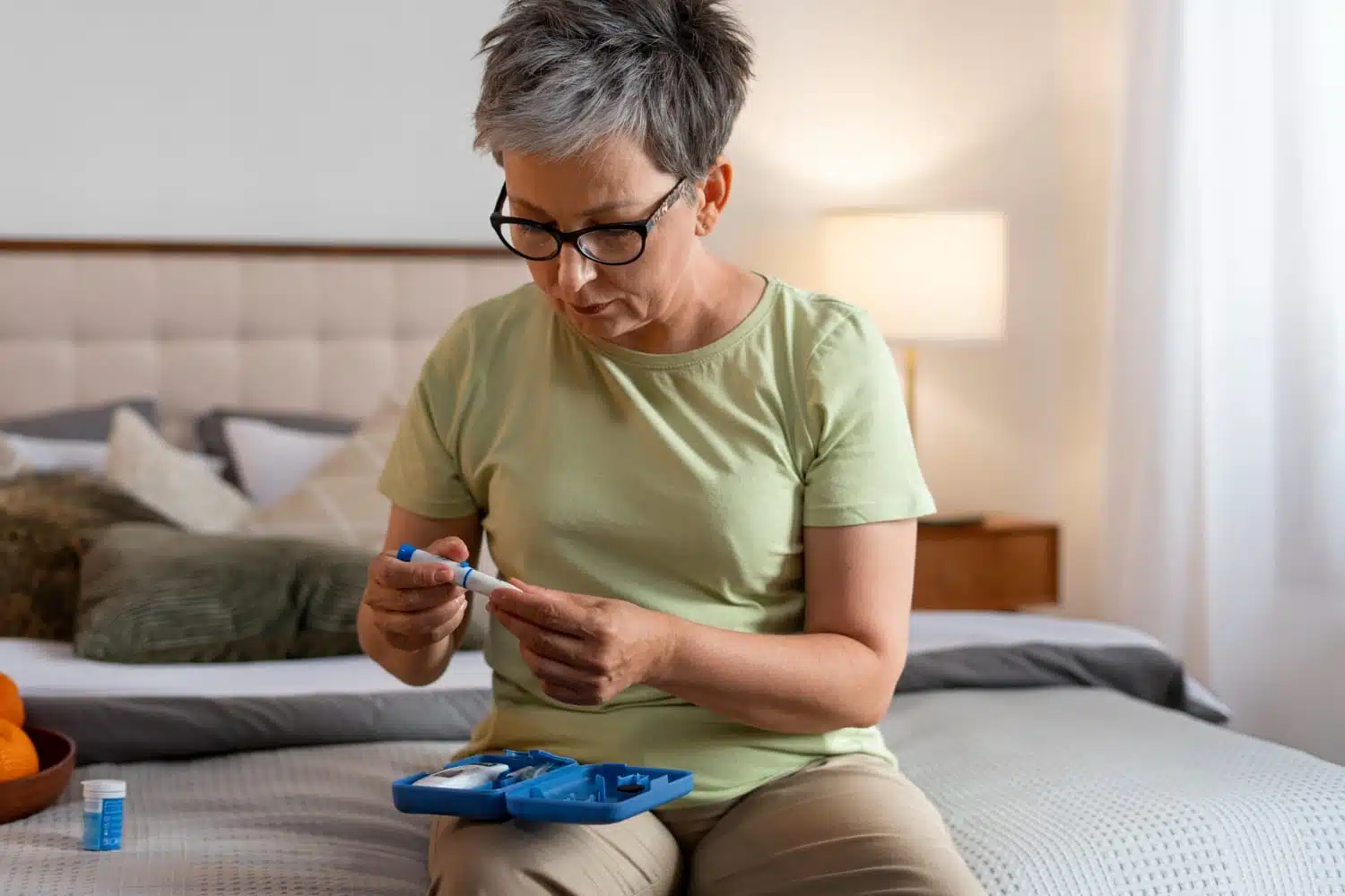 Woman preparing an insulin injection for diabetes management at home.
